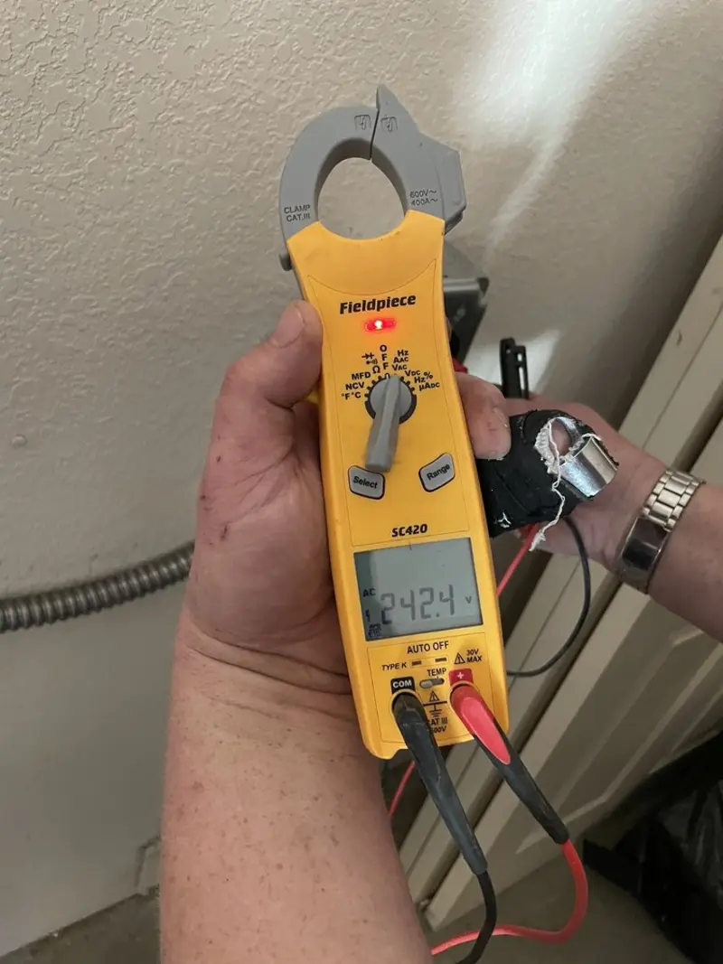 Voltage testing with clamp meter during Electrical Installation Services in Port Clinton